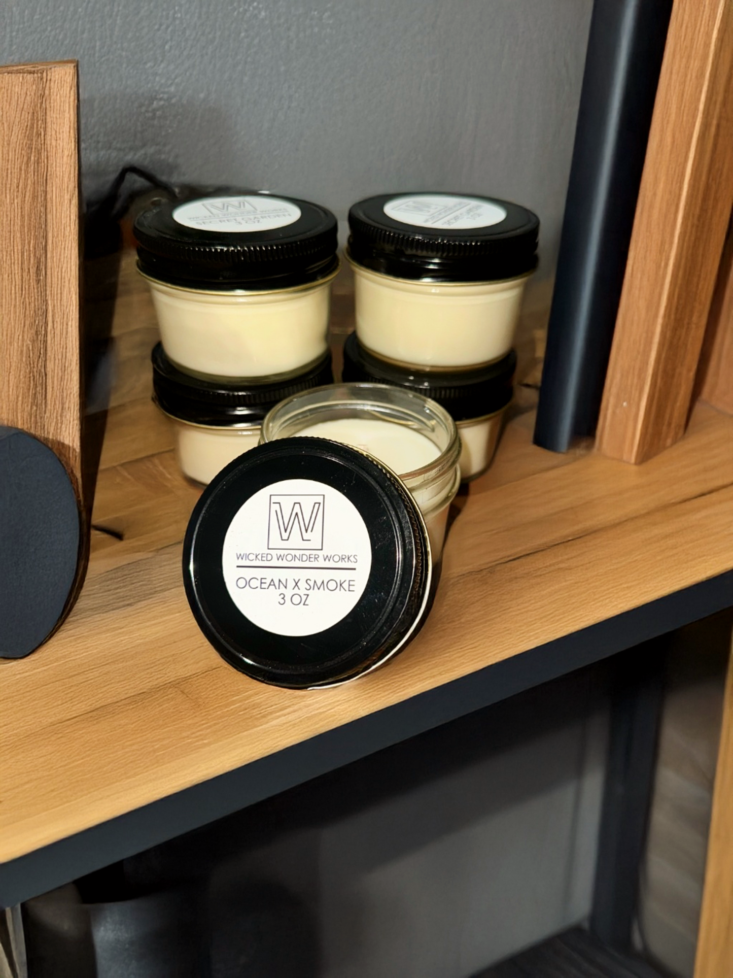 Masculine sampler pack of 5 candles displayed on shelf