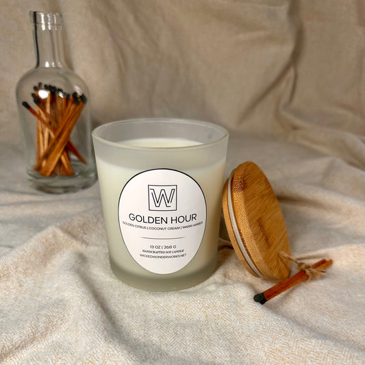golden hour soy candle by wicked wonder works. blend notes include golden citrus, coconut cream, and warm amber 